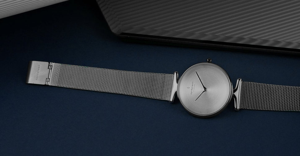 14mm watch strap on silver watch on blue background