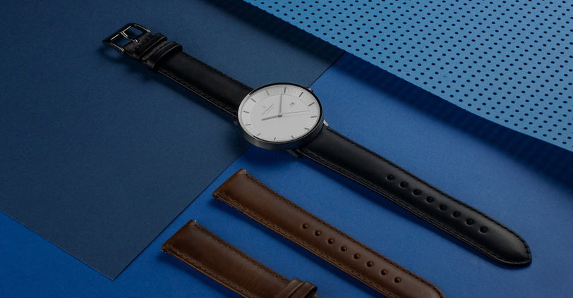 18mm watch strap with watch on blue background
